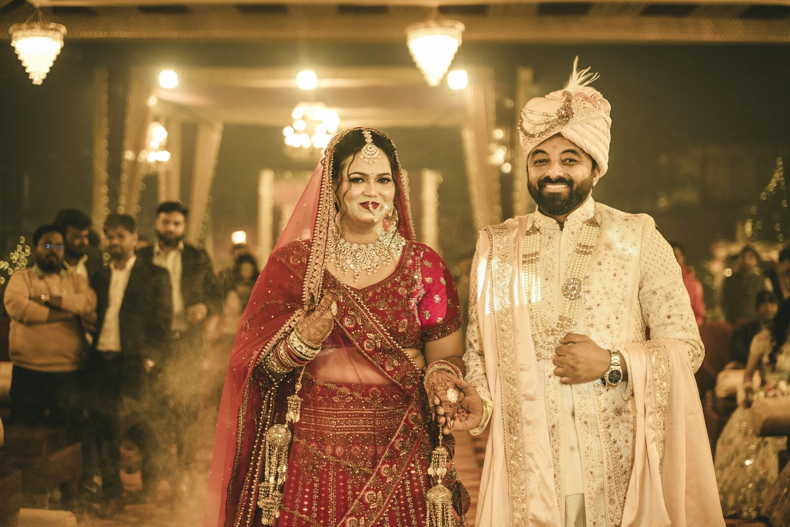Bride and groom entering the wedding venue through smoke and lights, Prayagraj