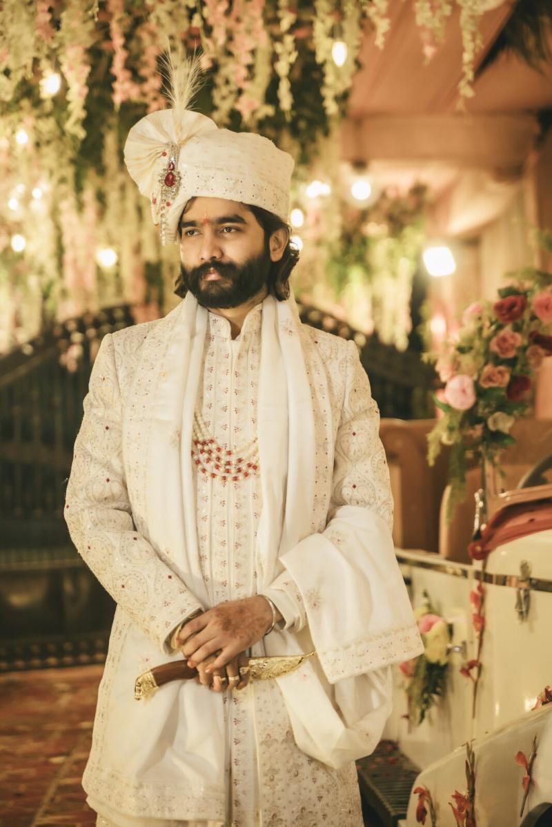 Groom in a white sherwani and safa before the baraat, Prayagraj wedding photographer