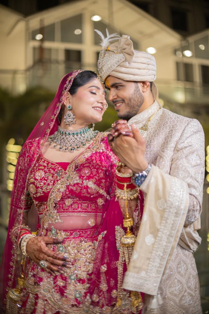 Bride and groom holding hands outside the venue, Prayagraj wedding photography