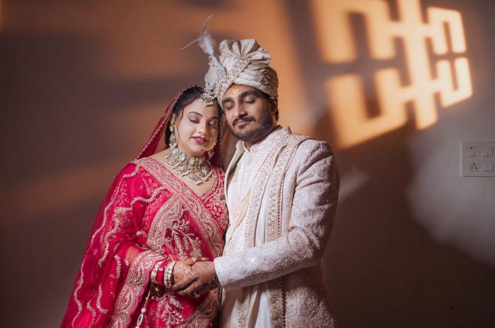 Bride and groom in patterned light, candid wedding photography in Prayagraj