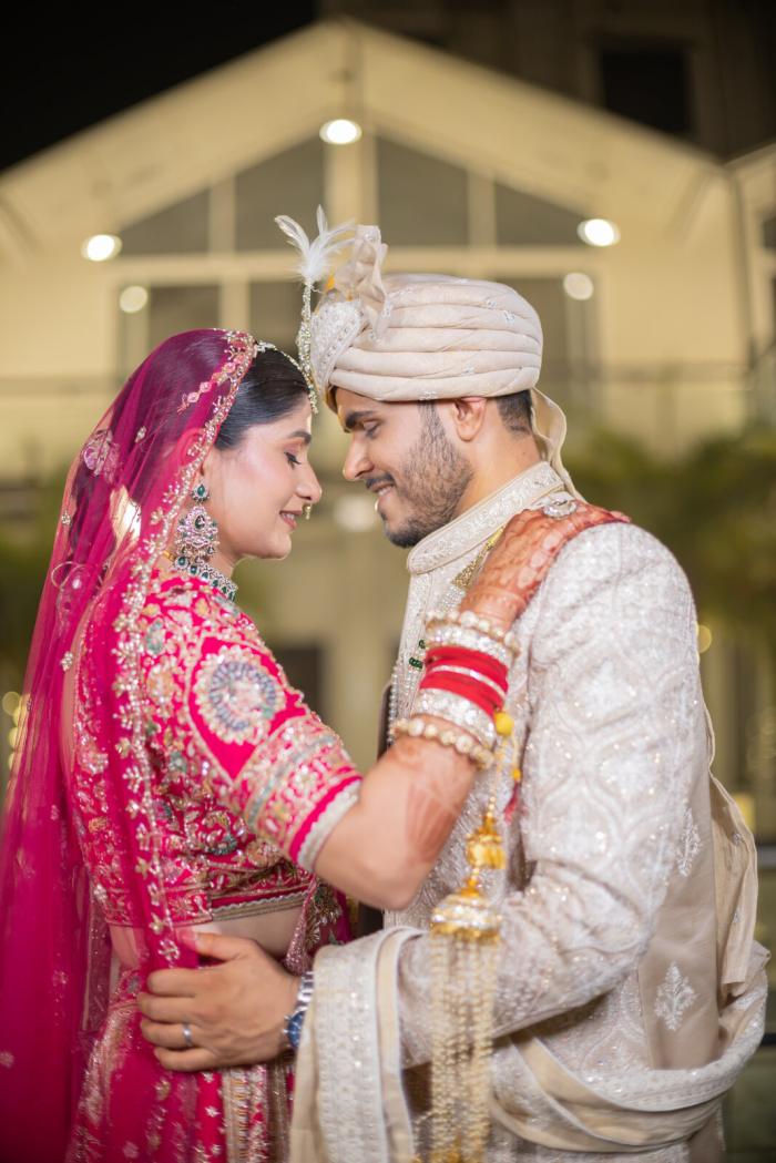 Bride and groom forehead to forehead in their wedding garlands, Prayagraj
