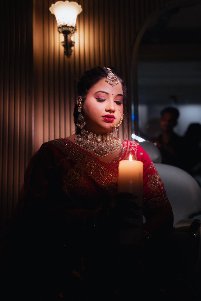 Bride by candlelight before the ceremony, Prayagraj wedding
