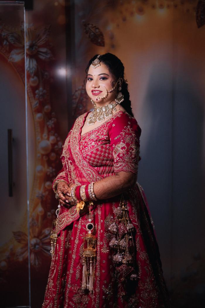 Bride in her red bridal lehenga before the ceremony, Prayagraj