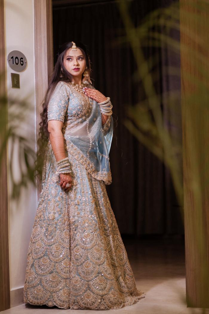 Bride in an ivory and silver lehenga, Prayagraj wedding photography