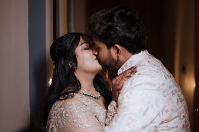 Bride and groom in a close moment on their wedding day, Prayagraj