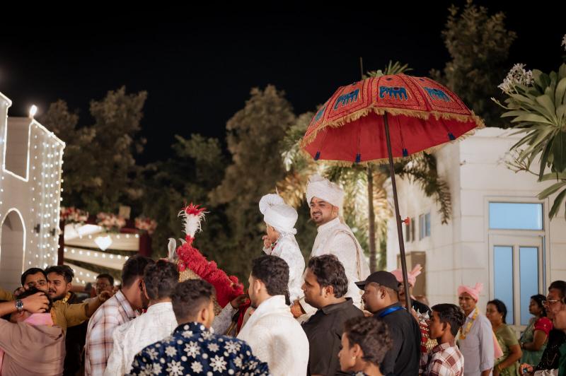 Family and friends dancing in the baraat, Prayagraj wedding