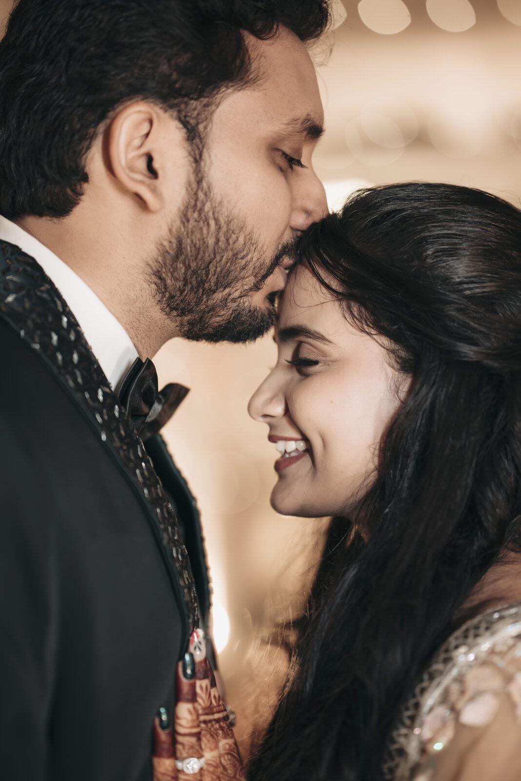 Bride and groom close together at their reception, Prayagraj wedding photographer
