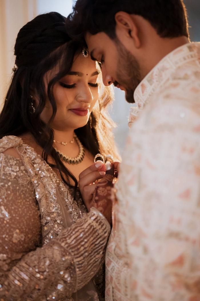 Bride and groom in a quiet forehead-to-forehead moment, Prayagraj