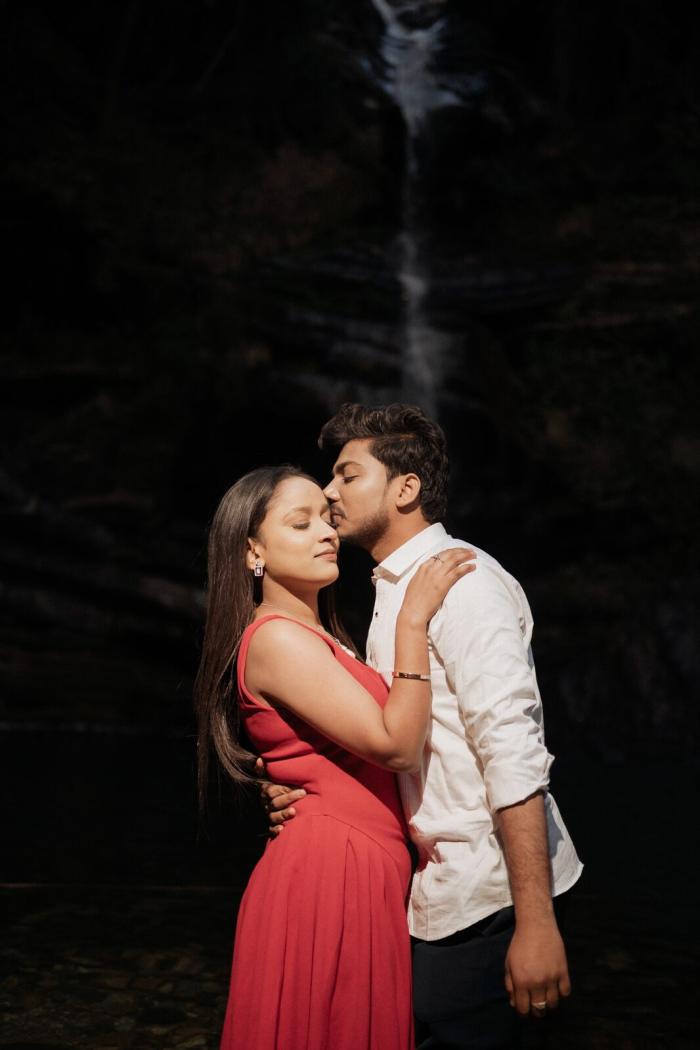 Bhalugaad Waterfall pre-wedding shoot near Mukteshwar — couple in front of the falls