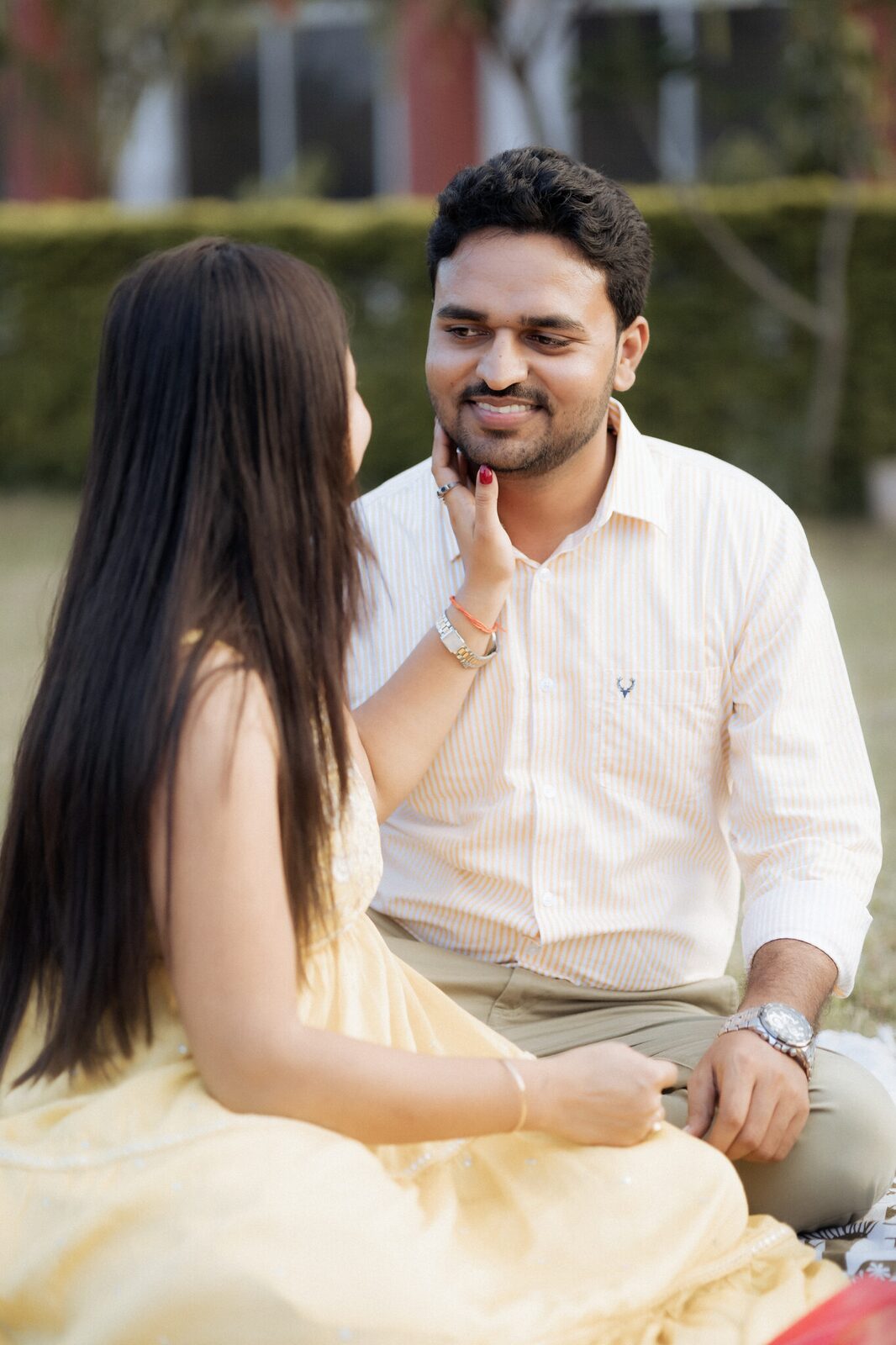 Laughing together at the garden picnic, Chitrakoot pre-wedding shoot