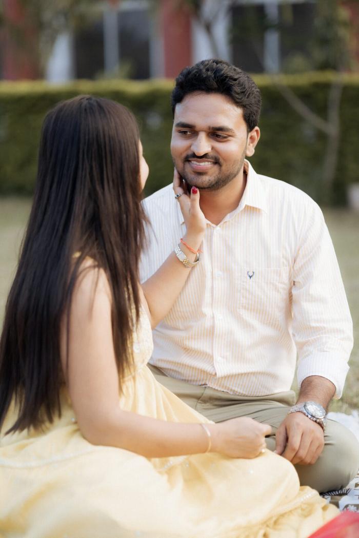 Laughing together at the garden picnic, Chitrakoot pre-wedding shoot