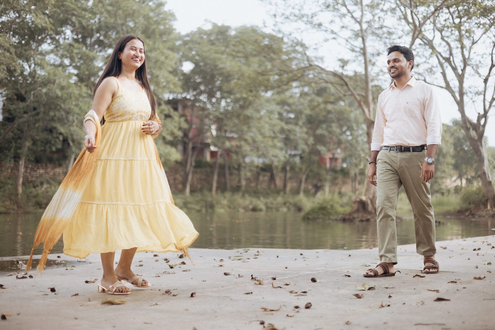 Yellow dress twirl by the riverside in Chitrakoot