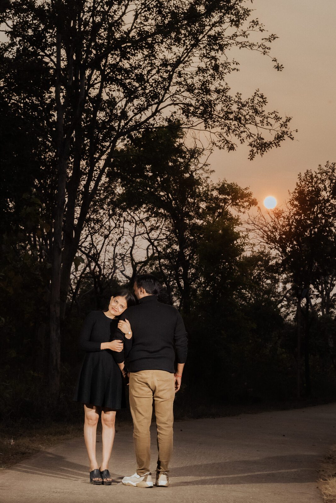 Couple on a forest road at sunset in Dharkundi