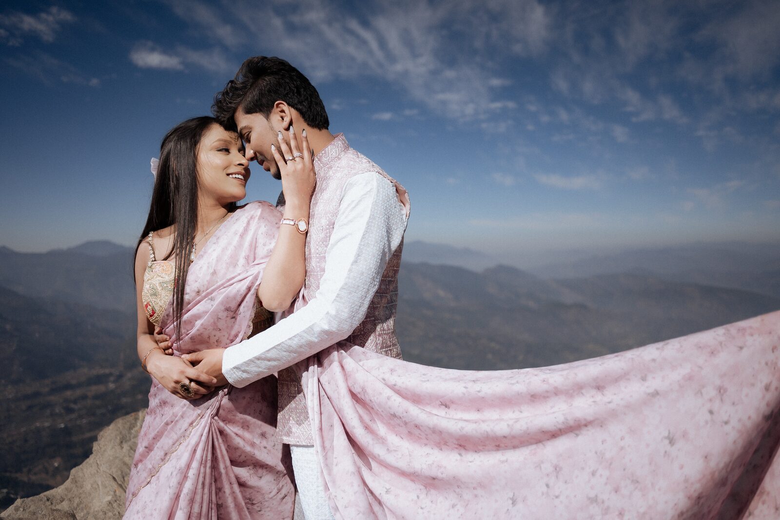 Dupatta lifting in the wind on the Mukteshwar cliff during a pre-wedding shoot