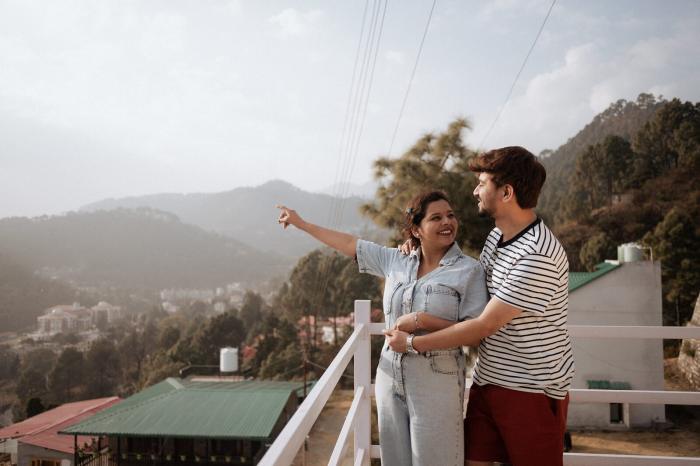 Couple looking out over the Nainital hills from a rooftop during their pre-wedding shoot