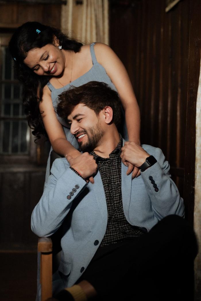 Candid pre-wedding portrait inside a wooden cottage in Sattal, Nainital