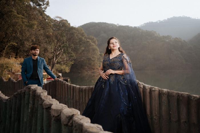 Bride-to-be walking along the lakeside railing at Sattal, Nainital