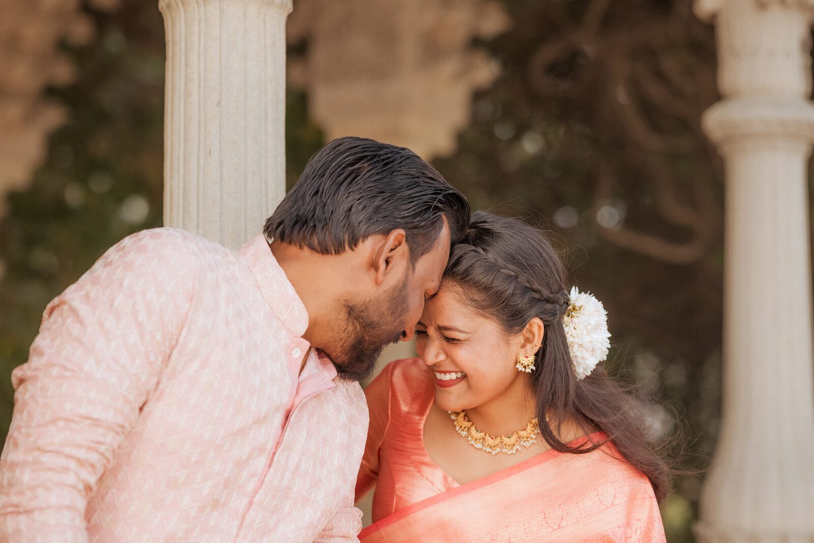 Forehead kiss beside a stone column at Ram Bagiya, Prayagraj