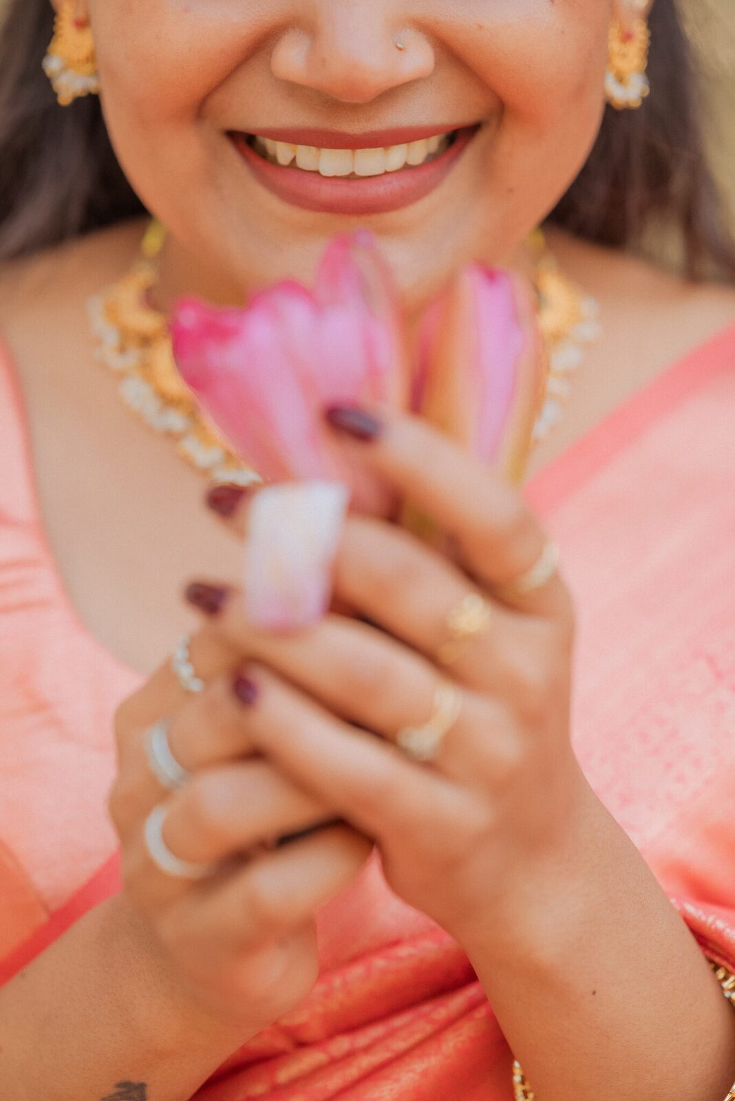 Close portrait with a lotus held to the face, Ram Bagiya Prayagraj