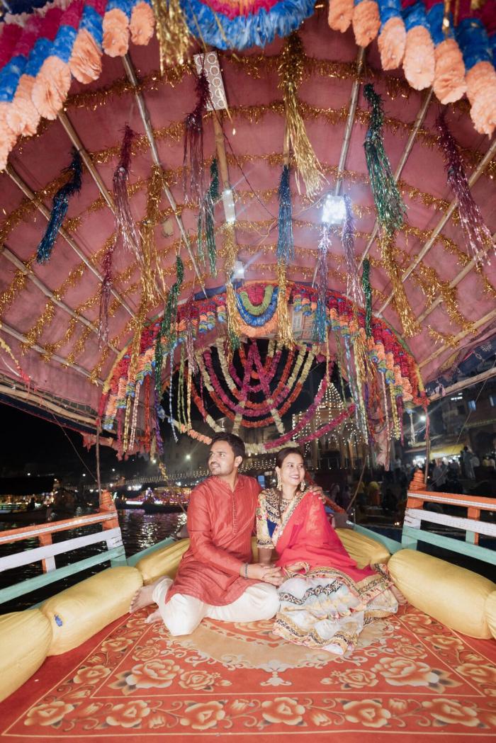 Wide view of the flower-decorated boat at Ram Ghat, Chitrakoot at night