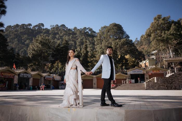 Sattal Lake pre-wedding shoot — couple walking hand in hand by the lakeside market