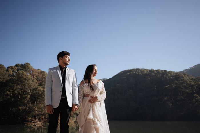 Backlit pre-wedding portrait against a deep blue sky at Sattal, Nainital