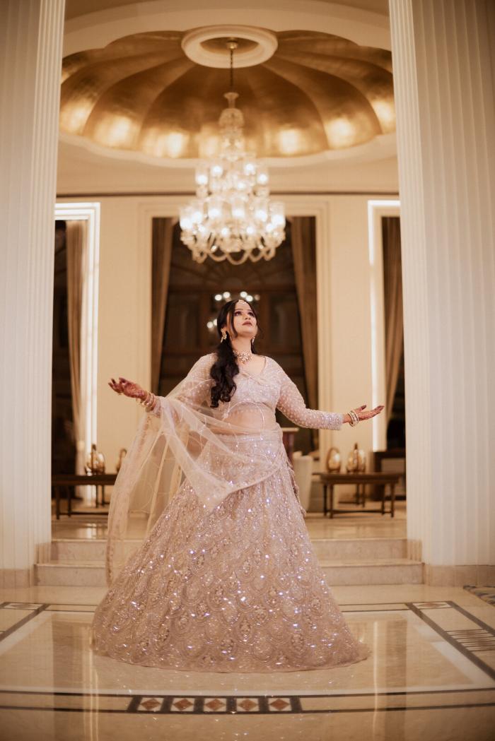 Bride twirling in the hotel lobby, Allahabad wedding photography