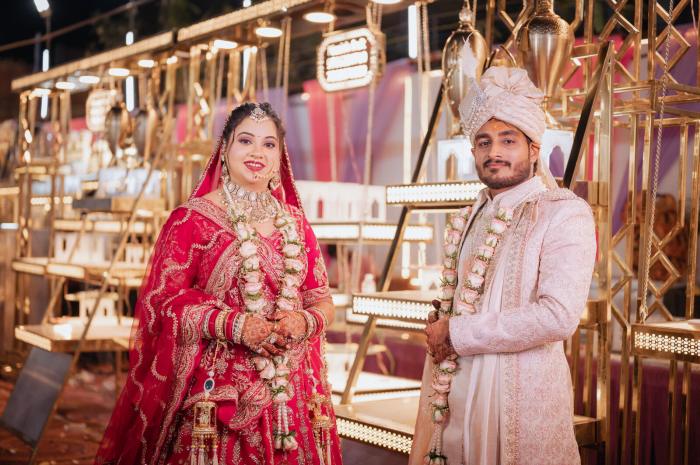 Bride and groom at the gold-lit mandap, Allahabad wedding