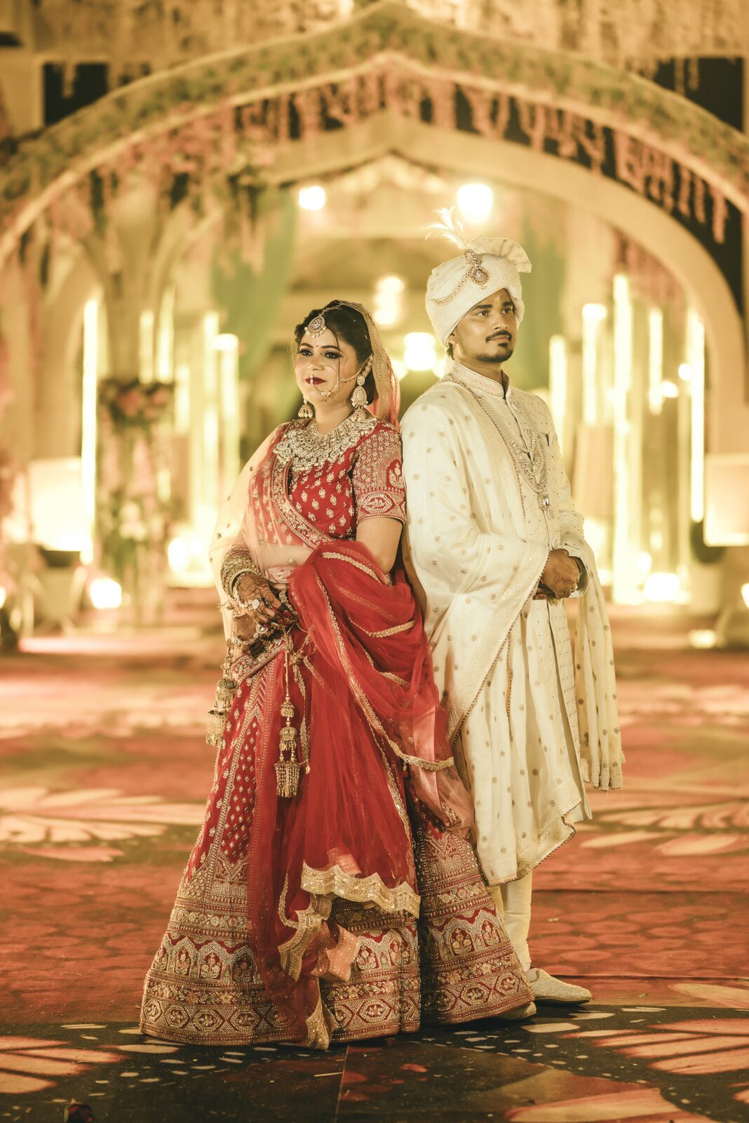 Bride and groom in a golden banquet hall, wedding photography package coverage