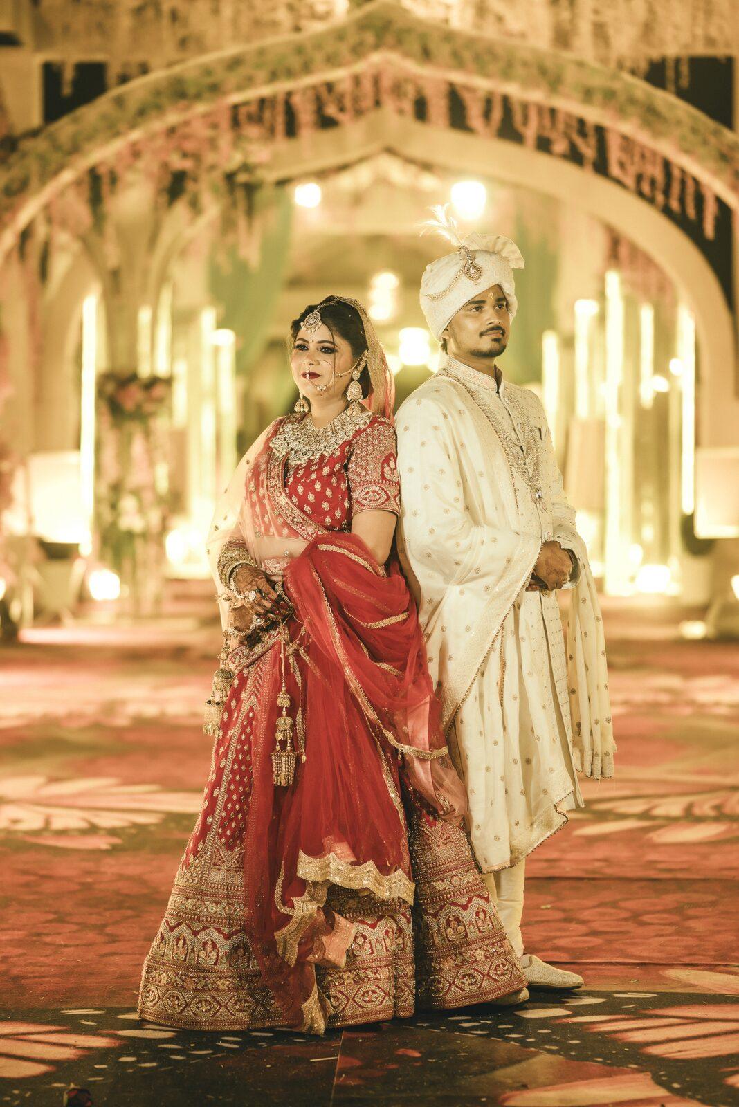 Bride and groom in a golden banquet hall, wedding photography package coverage