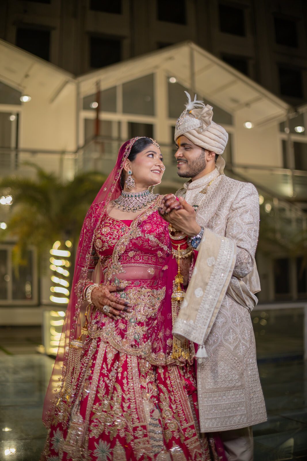 Bride and groom in the hotel courtyard on their wedding day, Prayagraj
