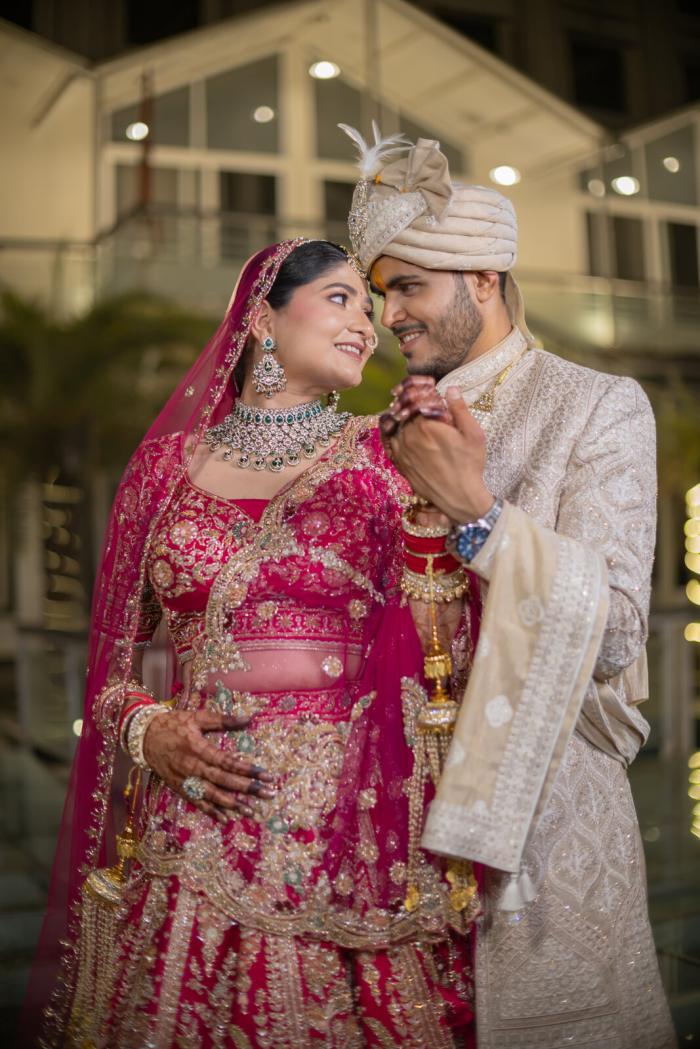 Bride and groom sharing a moment outside the venue, Prayagraj wedding coverage