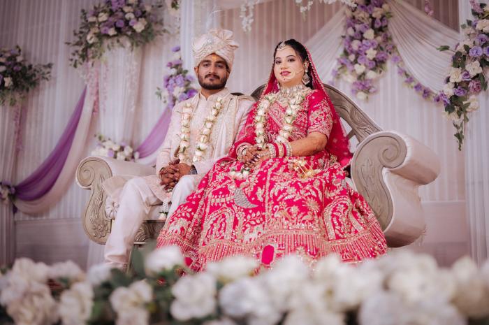 Bride and groom on the reception stage, Prayagraj wedding coverage